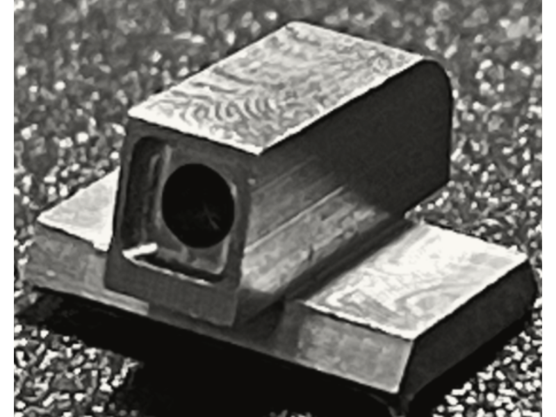 Aro-Tek tritium gun sight on concrete — precision machined in Tumwater, WA